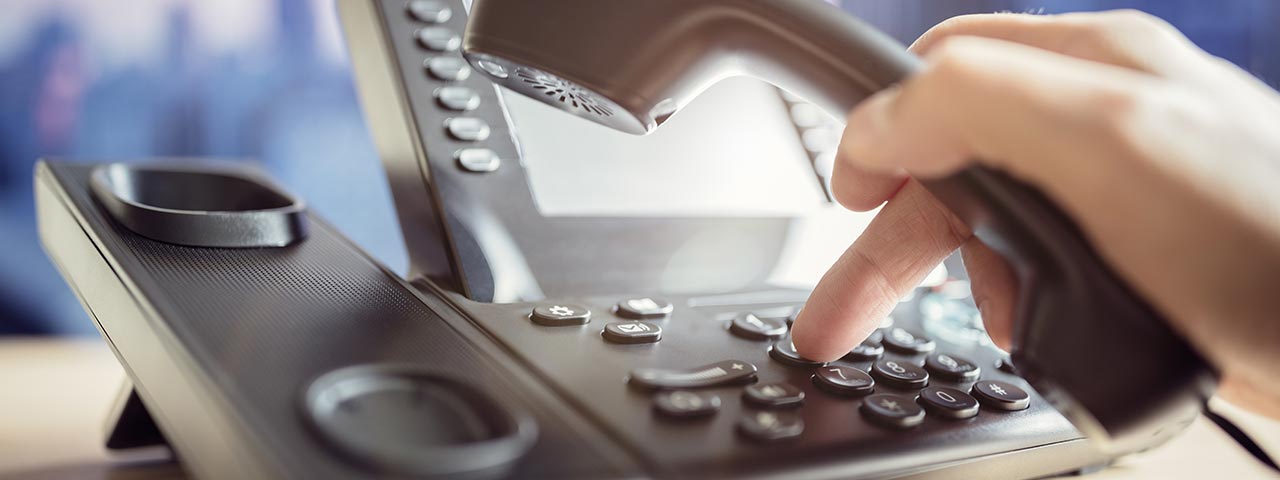 Person using a VoIP Phone System Business Phones Systems in Phoenix